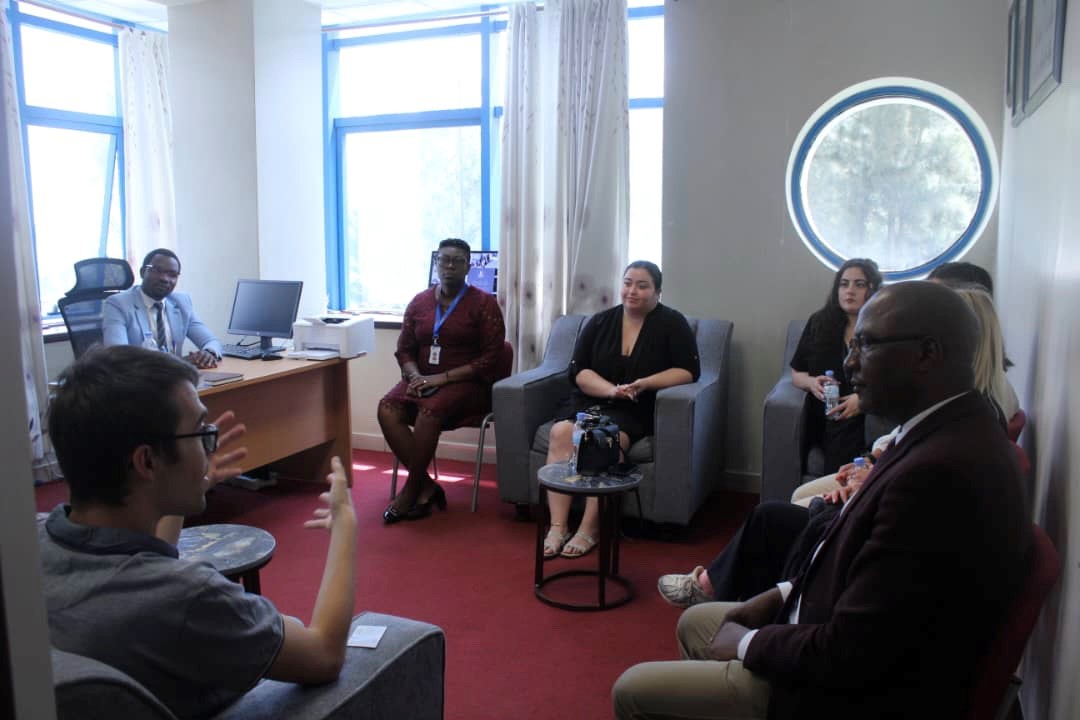 Staff from University of Kigali and Nicosia listening to a presentation in UoK's Musanze Campus Principal's Office.