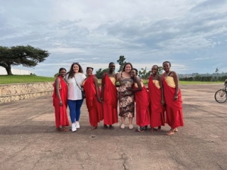 Staff from University of Nicosia posing with traditional Rwandan dancers