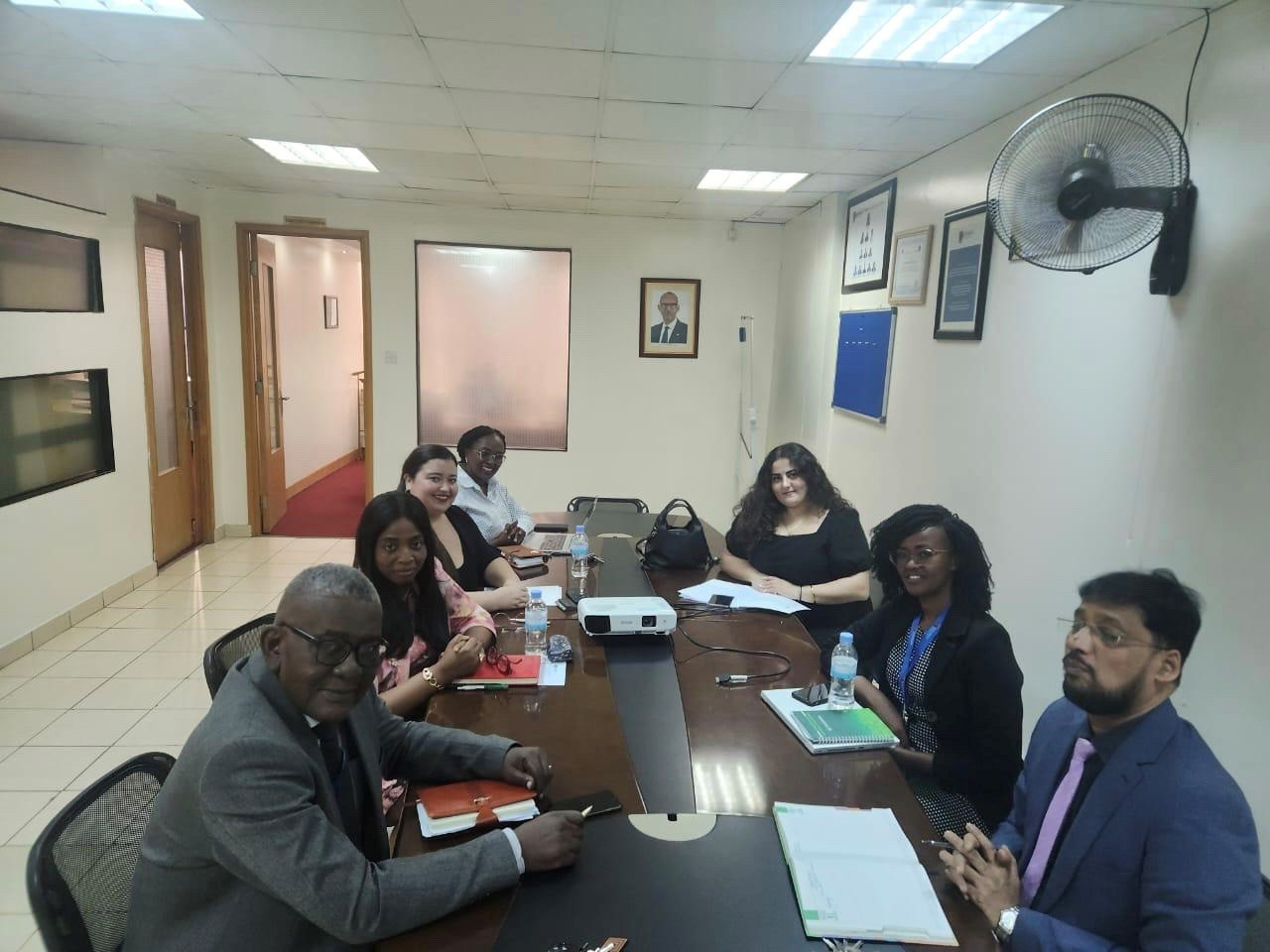 Staff from University of Kigali and Nicosia sitting around a conference room table