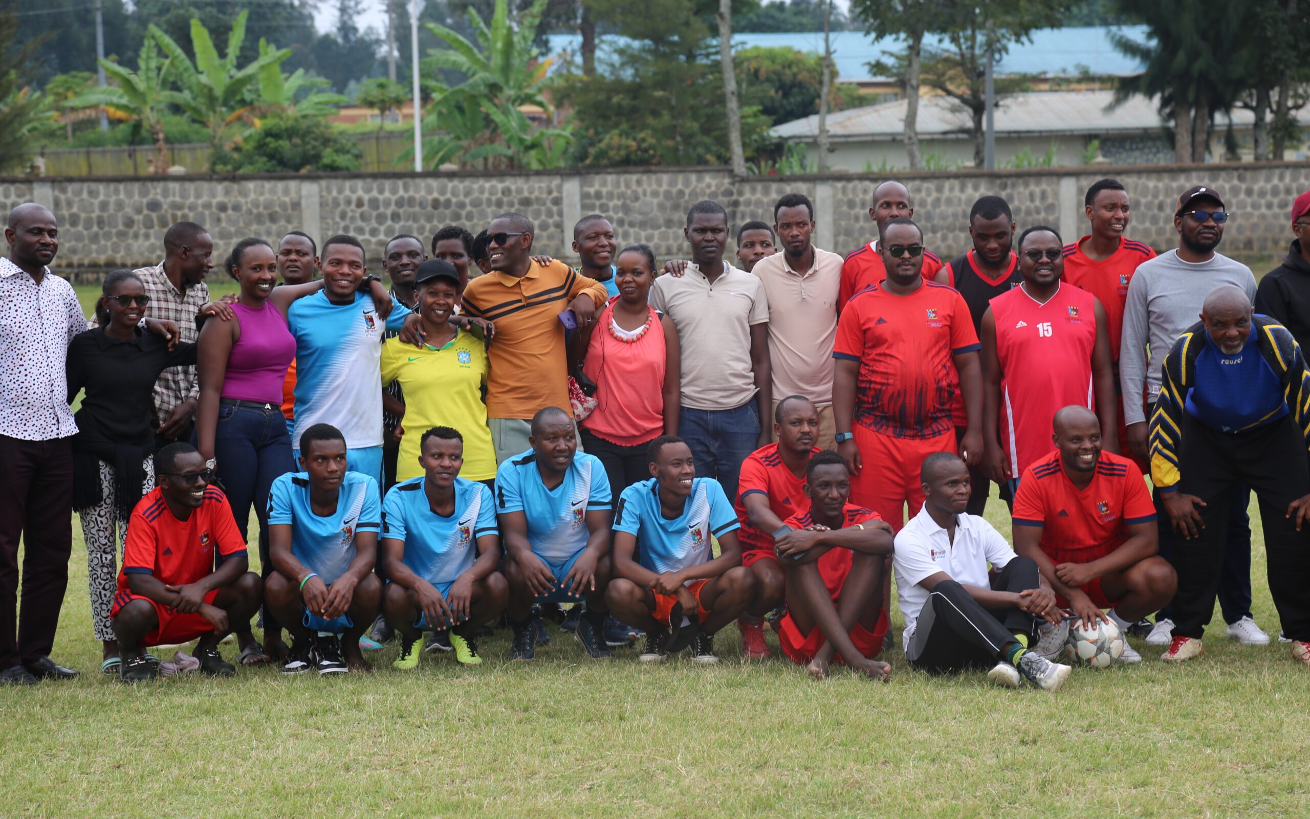 University of Kigali's Kigali and Musanze staff pose for a group photograph before the friendly match.