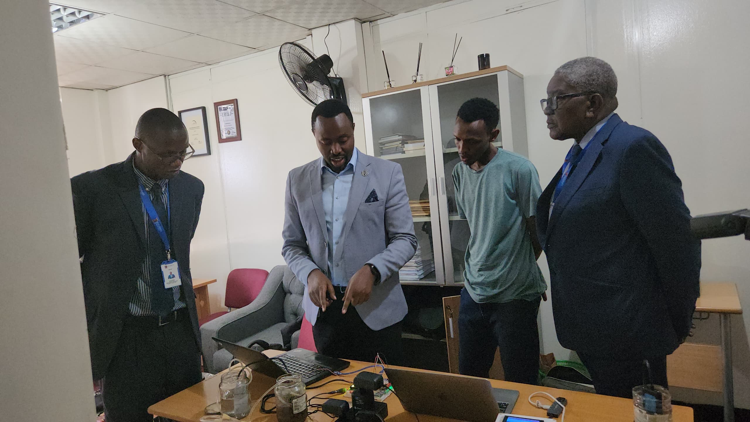 University of Kigali Researchers demonstrating the Smart Agriculture irrigation Prototype to the Research and Innovation Management