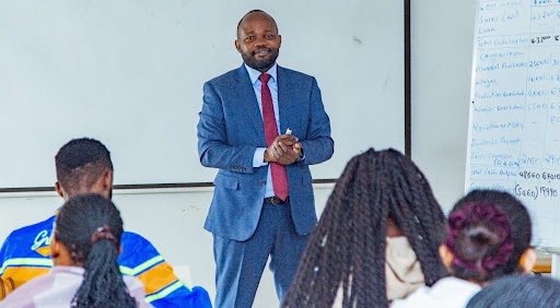Mr. Charles Omanyo Director of School of Professional and Executive programmes during the classroom.