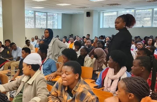 An international student asks a question during an interactive session with the Chairman at the University of Kigali’s Musanze Campus.