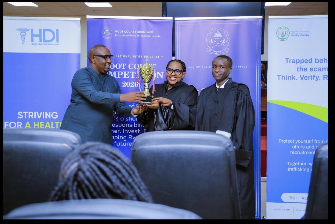 University of Kigali representatives receive the Moot Court trophy